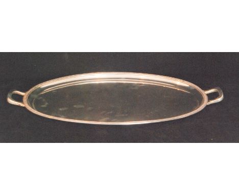 A George VI hallmarked silver twin handled oval tray of plain form with cast Celtic border, weight 51oz, length 55cm, Birming