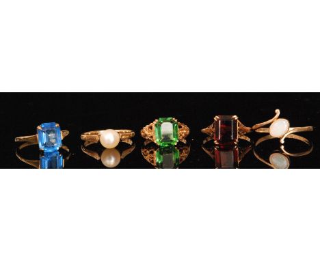 Five mid 20th Century 9ct stone set rings to include opal, pearl and garnet examples. (5). 