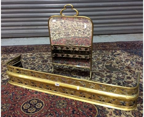 A late 19th Century pierced brass fender with trailing leaf design, length 114cm, together with a mirror back firescreen (2)