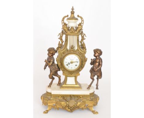 A 20th Century French replica mantle clock by Regnant Paris, the movement flanked by two fauns on a marble and gilt plinth ba