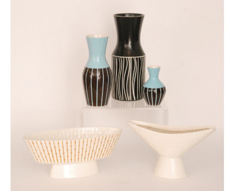 A small collection of assorted Hornsea wares to include a vase with carved white wavy decoration, two blue vases with brown p