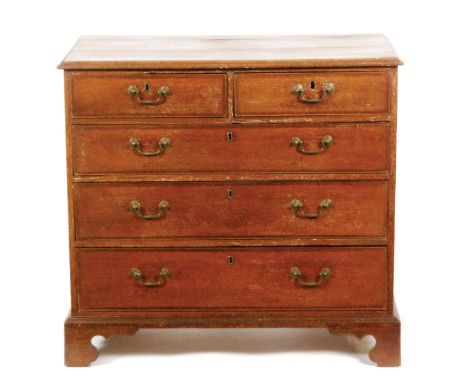 A George III oak chest of two short and three long crossbanded cockbeaded drawers fitted with brass swan neck handles on brac
