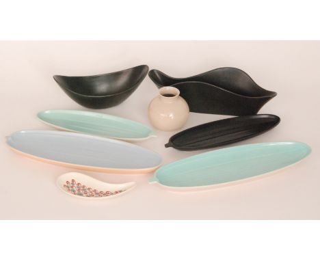 A collection of assorted 20th Century Poole Pottery to include a Freeform teardrop dish, four cucumber dishes and two black g