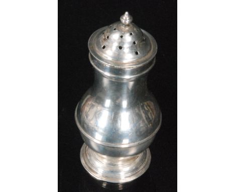 An 18th Century hallmarked silver pepper of plain baluster from terminating in spire finial, height 9.5cm, London 1745.