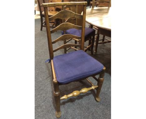 A harlequin set of twelve late 19th to early 20th Century oak, ash and beech ladder back dining chairs, with turned front str