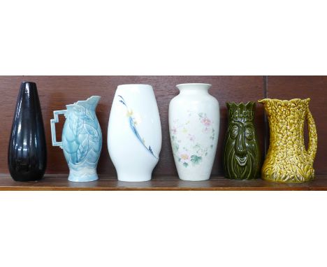 Six vases including Wedgwood, Poole and Sylvac, (blue and yellow jugs a/f)