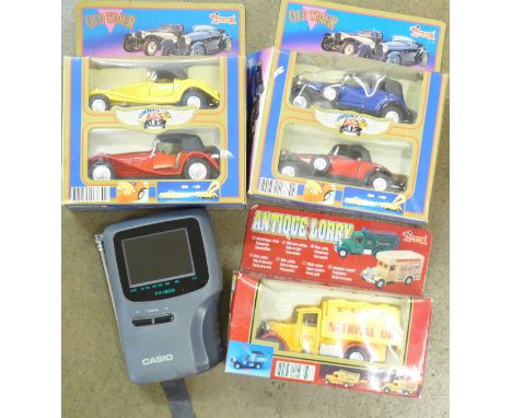 A Casio hand held Casio TV-1800 television and boxed model vehicles 
