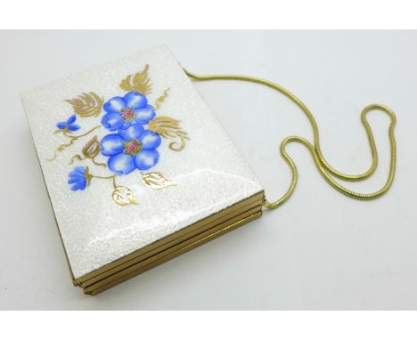 A gilt metal combination compact with enamel top 