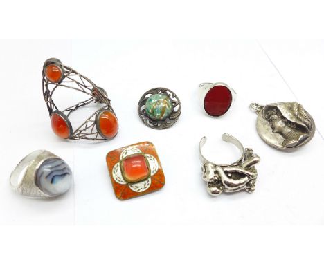 A silver and abalone cabochon ring, a silver and cornelian ring, an enamel and orange stone brooch, an Art Nouveau stone set 