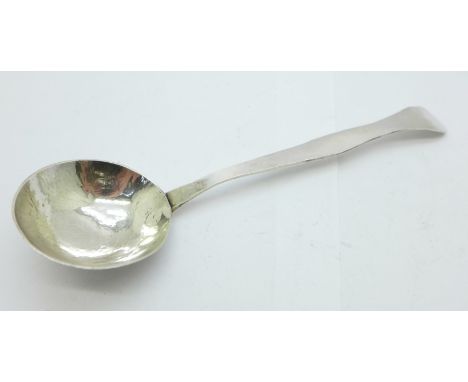 A hammered silver ladle, London 1952, 33g 