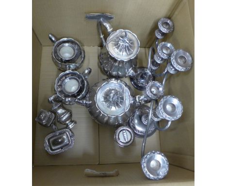 A four piece plated melon shaped tea service, two candelabra, etc. **PLEASE NOTE THIS LOT IS NOT ELIGIBLE FOR POSTING AND PAC