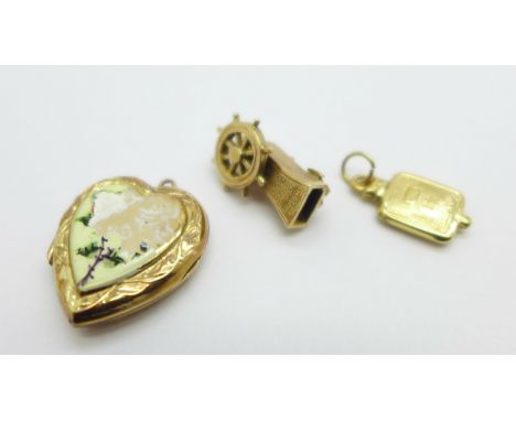 Two 9ct gold charms including a ships wheel and a 9ct back and front locket, enamel a/f, charms 2.9g 