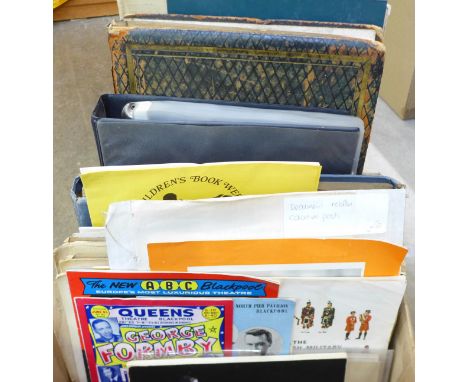 A box of ephemera containing a vintage postcard album, an Atlas, photographs and other ephemera 