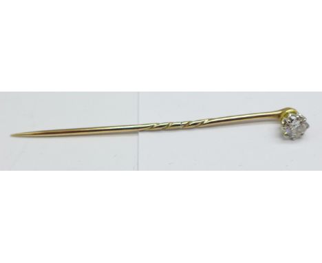 A yellow metal set diamond stick pin, approximately 0.4carat weight 