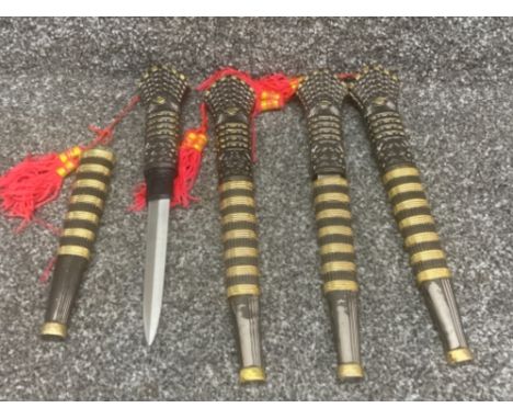 Four oriental decorative hunting knives with red tassels