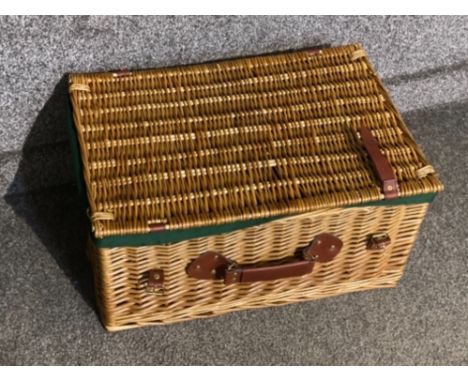 Wicker picnic hamper with brown leather straps
