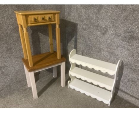 A white laminate wall shelf and two lamp tables