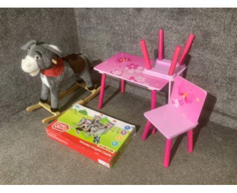 Chad Valley wooden knights castle, a rocking donkey and a pink table and two chairs