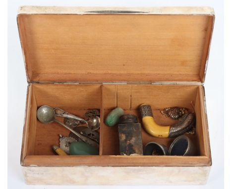 An early 20th century silver cigarette box, London 1923, with various small items including a jade pendant, fruit knife, with