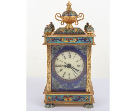 A 20th century brass and enamel mantle clock, side panels showing naïve depictions on ladies, 19cmH