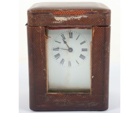An R & Co, Paris carriage clock, white enamel dial with Roman numerals, in travel case with key, 11cmH