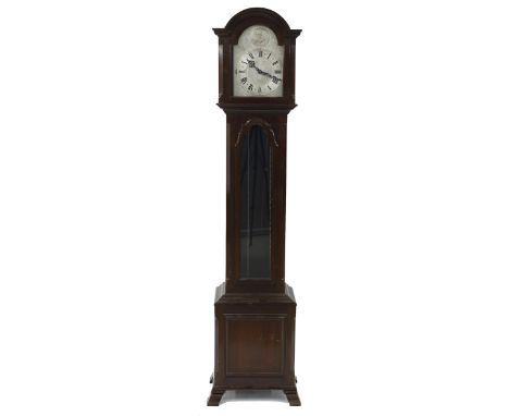 Mahogany three train grandmother clock, the movement playing on eight rods, the 10.5" silver foliate engraved dial with silen