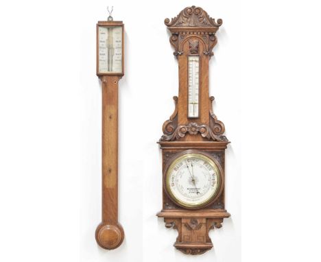 Oak stick barometer/thermometer, the silvered angled scale signed Davis, Leeds, over a flat trunk and circular stepped turned