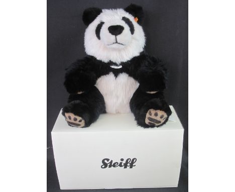 Steiff 'Manschli Panda' tags and yellow label no. 064258, in original box.
(B.P. 24% incl. VAT) CONDITION REPORT: Excellent c