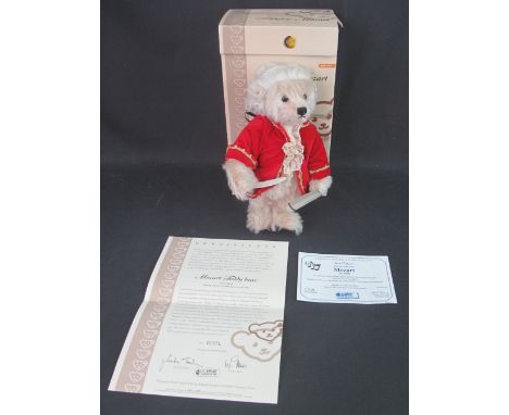 Modern Steiff 'Mozart' teddy bear wearing a hand styled wig and velvet jacket with musical action which plays: 'Eine Kleine N