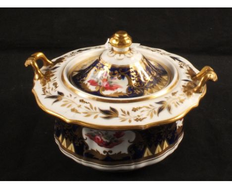 An early 19th Century sucrier with blue ground and gilding with floral reserves