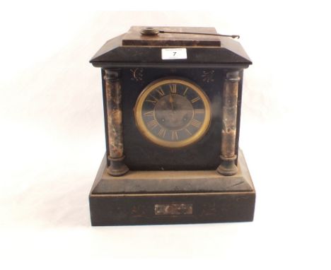 A Victorian black and variegated marble striking mantel clock