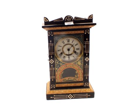 An ebonised and gilt striking mantel clock