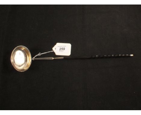 A white metal toddy ladle with Queen Anne shilling inset