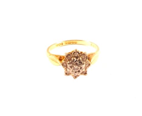 An 18ct gold diamond cluster ring, size M
