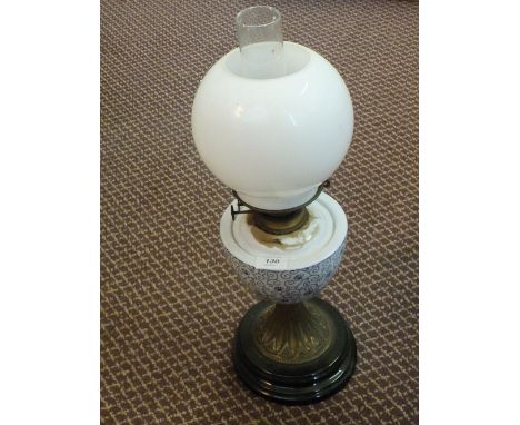 A brass and milk glass oil lamp