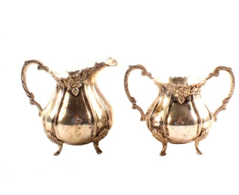 A white metal sucrier and cream jug, marked silver