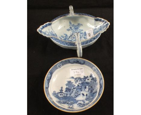 An 18th Century Chinese oval dish with animal handles and floral decoration (light rim chips) plus a chinoiserie saucer (rim 