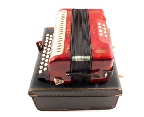 A cased Hohner Erica accordion