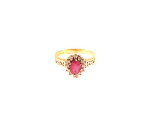 An 18ct gold ruby and diamond ring, size L