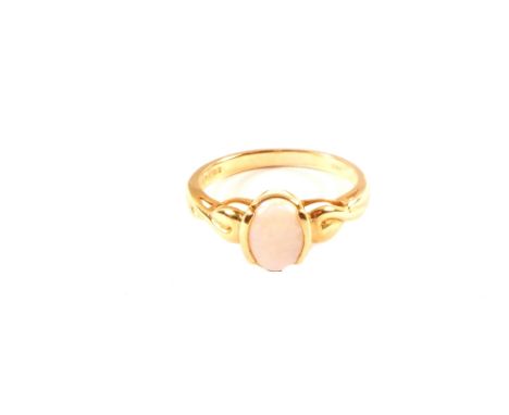 A 9ct gold opal set ring with twisted shoulder detail, size M