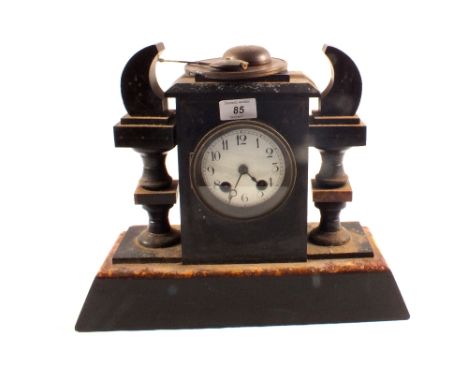 A Victorian black and variegated marble striking mantel clock