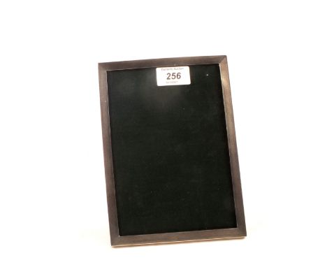 A silver engine turned photo frame