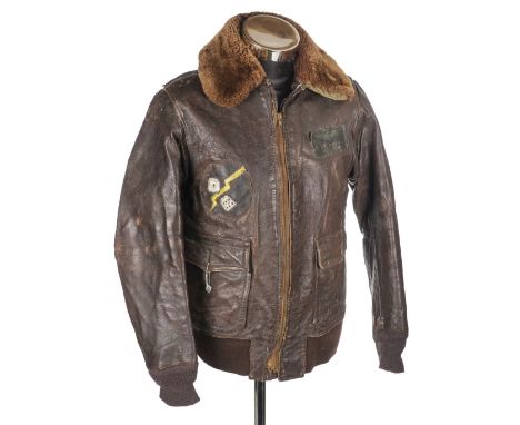 * Flying Jacket. A WWII USMC M.422A flying jacket worn by Lieutenant A.T. House Jr, brown leather with name badge to left bre