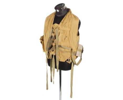 * Mae West. A WWII RAF 1941 pattern life-saving waistcoat, fitted with grab handles, leg ties, battery and light pouches, whi
