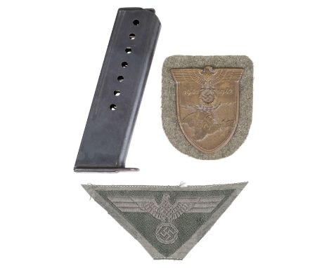 * WWII Germany. WWII German M44 tunic breast eagle cloth badge together with Krim Shield, green backing, awarded to military 