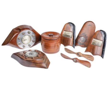 * Propeller. A WWI clock made from the hub of a mahogany propeller, the circular dial with black Arabic numerals secured by a