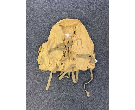 * Mae West. A WWII RAF 1941 pattern life-saving waistcoat, fitted with grab handles, leg ties, battery and light pouches, whi