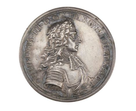 * Landing of William of Orange at Torbay, 1688. A cast silver medal by George Bower, the obverse with a cuirassed bust of Wil