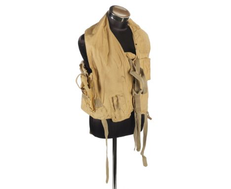 * Mae West. A WWII RAF 1941 pattern life-saving waistcoat, fitted with grab handles, leg ties, battery and light pouches, whi