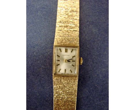 A Certina 9ct gold Ladies Wrist Watch, rectangular silvered dial inscribed Certina Swiss Made, manual wind, original integral